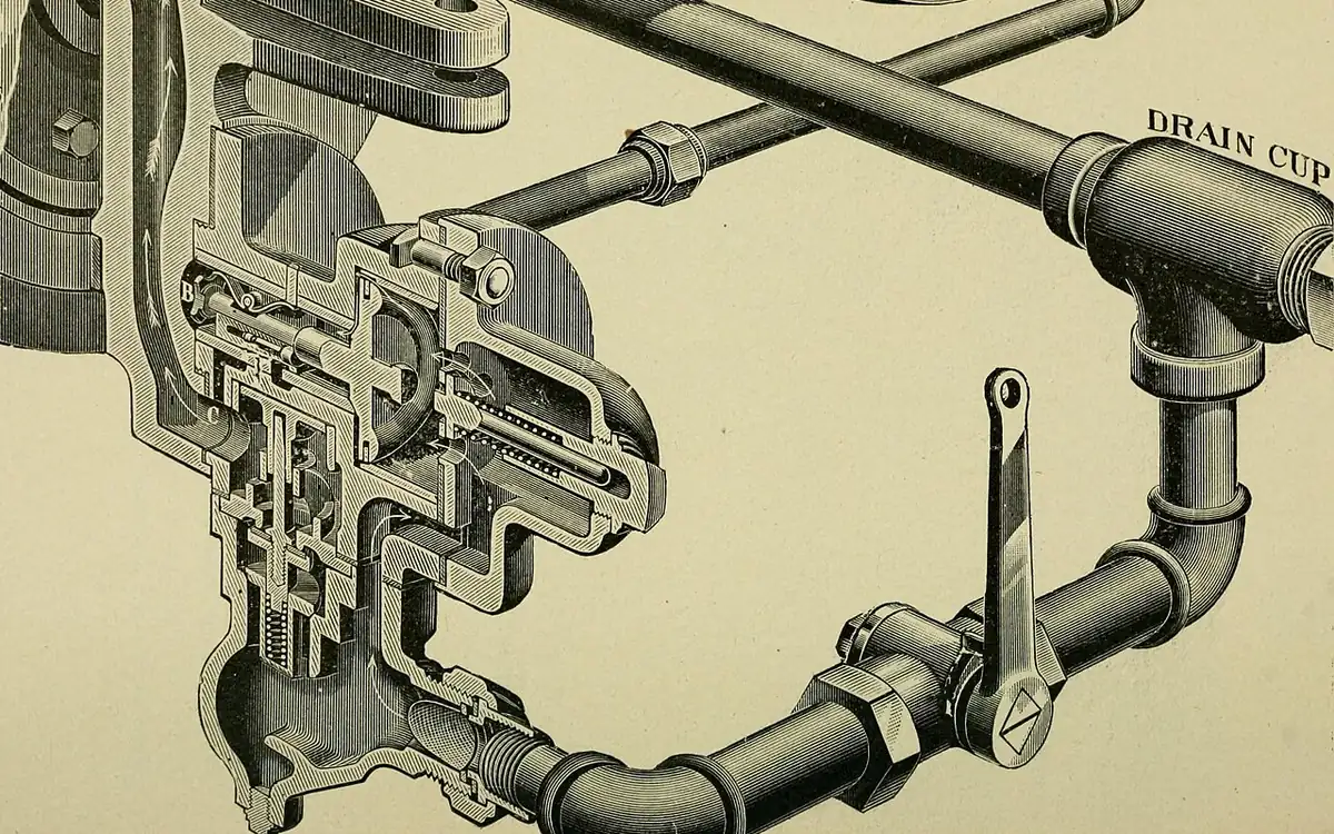 Close-up of car brake disc and pads in a workshop