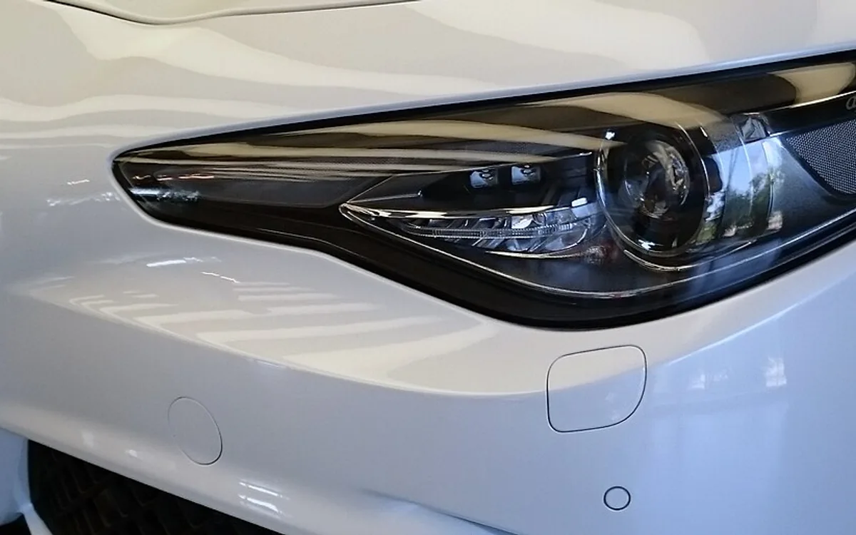 Restoring a cloudy yellowed car headlight with sanding and polishing