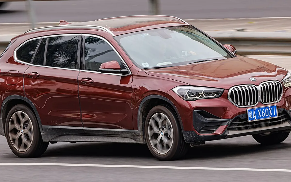 SUV and sedan parked side by side for comparison